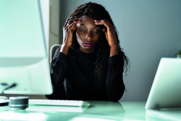 Person stressed at desk