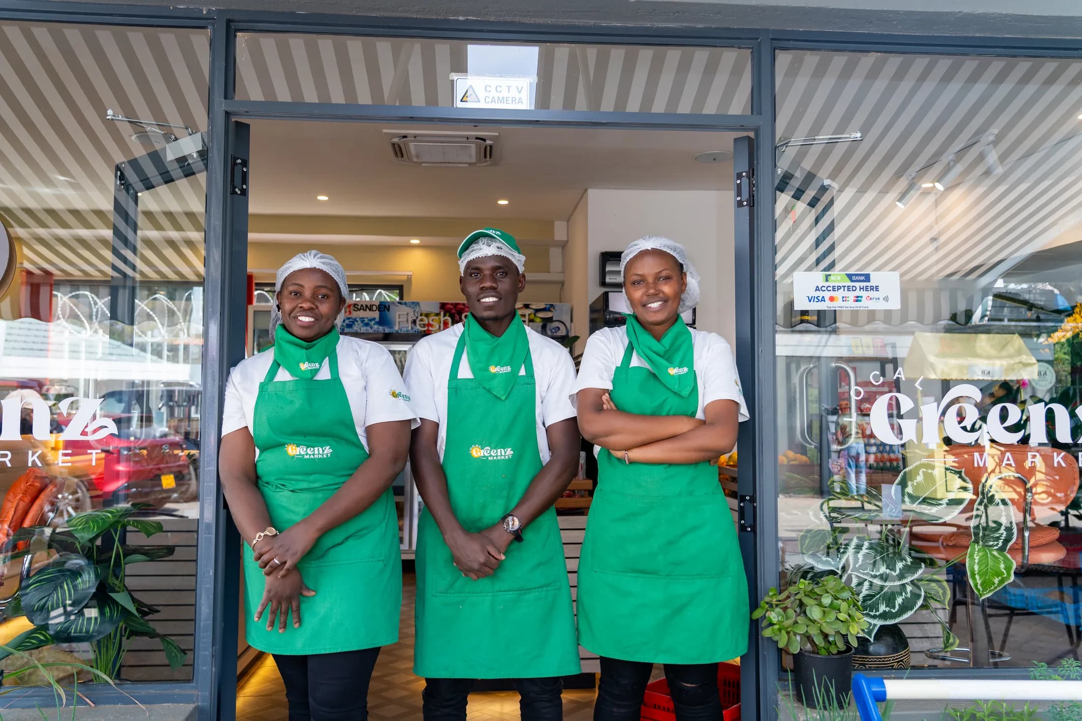 The Local Greenz Market team standing in the shop doorway