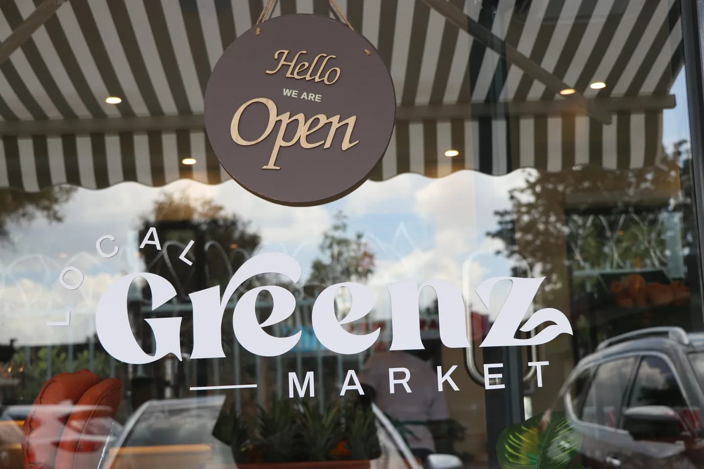 Local Greenz Market storefront, open sign on the window